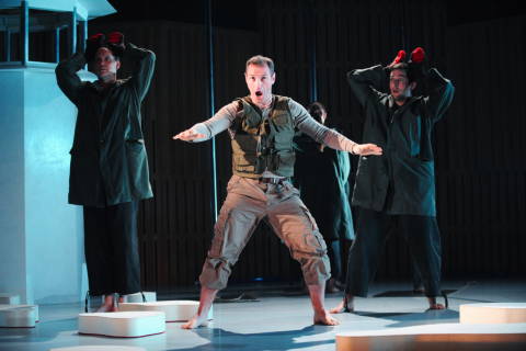 Andrew Rees as Lemminkäinen with Graeme Broadbent (left) and Nicholas Sharratt (right) as dogs in the Opera North production of 'Swanhunter' by Jonathan Dove and Alasdair Middleton. Photo © 2009 Tristram Kenton