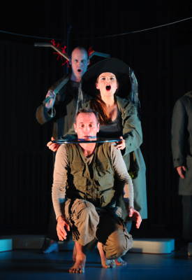 Andrew Rees as Lemminkäinen (front) with Frances Bourne as Louhi (centre) and Graeme Broadbent (ensemble, back) in the Opera North production of 'Swanhunter' by Jonathan Dove and Alasdair Middleton. Photo © 2009 Tristram Kenton