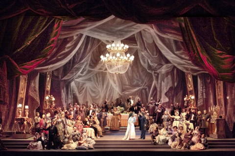 Myrtò Papatanasiu, Antonio Gandìa and the chorus in the 'Traviata' toasting scene. Photo © 2009 Corrado Maria Falsini